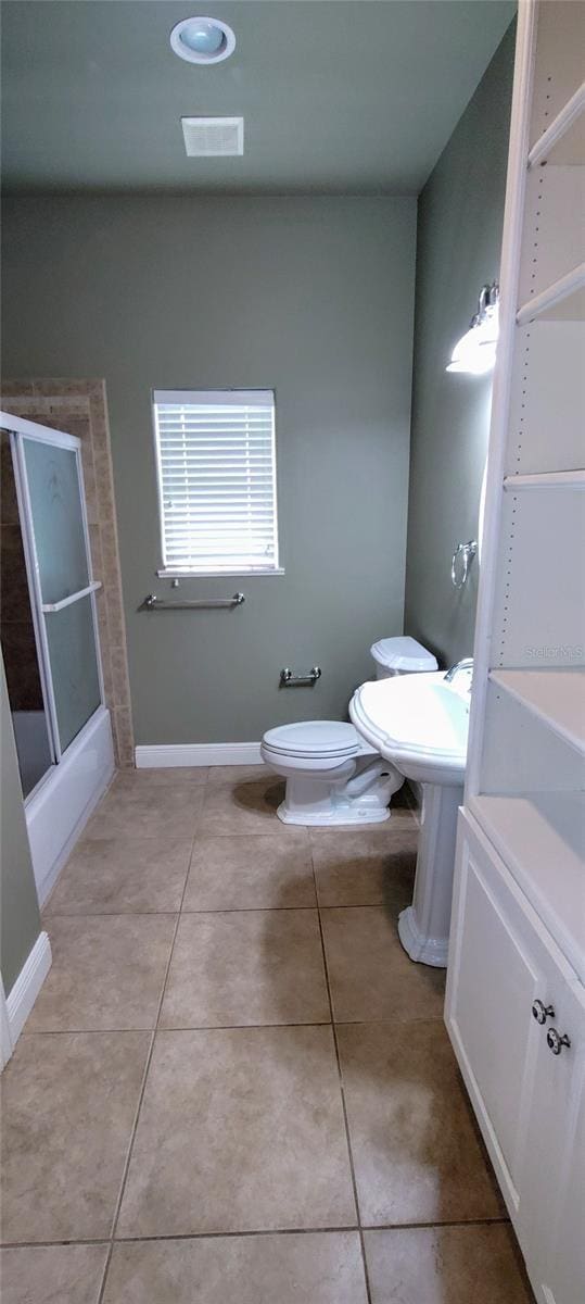 5595 Schefflera, Grant, FL 32949 - full bathroom featuring tile patterned flooring and a shower