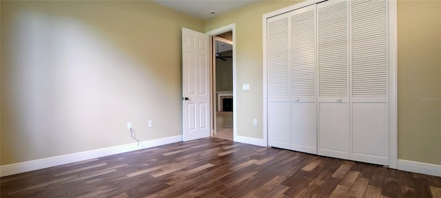 5595 Schefflera, Grant, FL 32949 - unfurnished bedroom featuring a closet and dark wood-style flooring