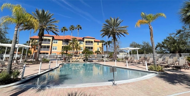 community pool with a patio area