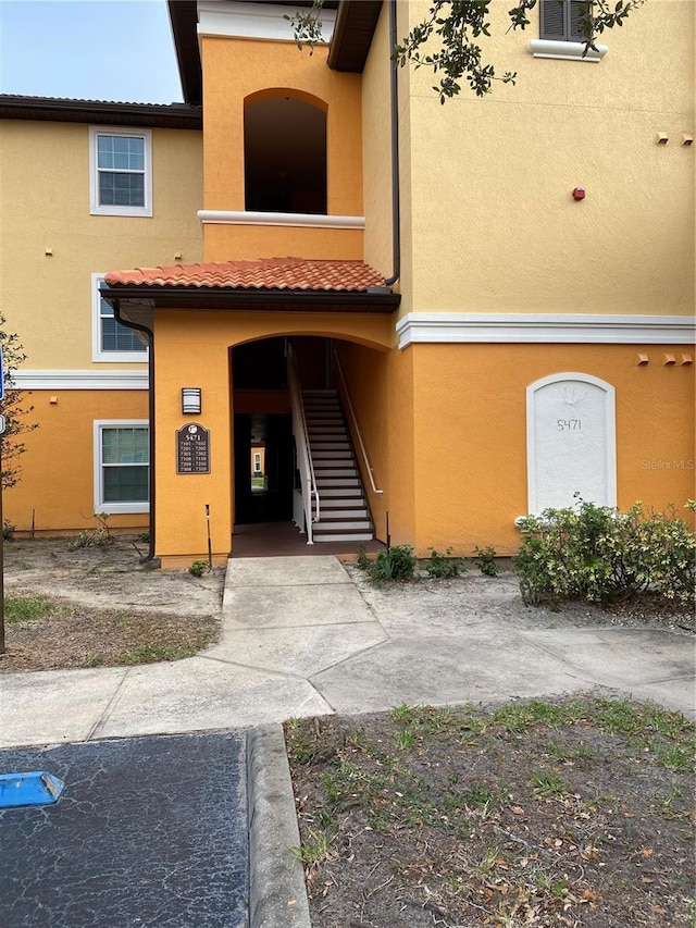 view of property featuring stairs