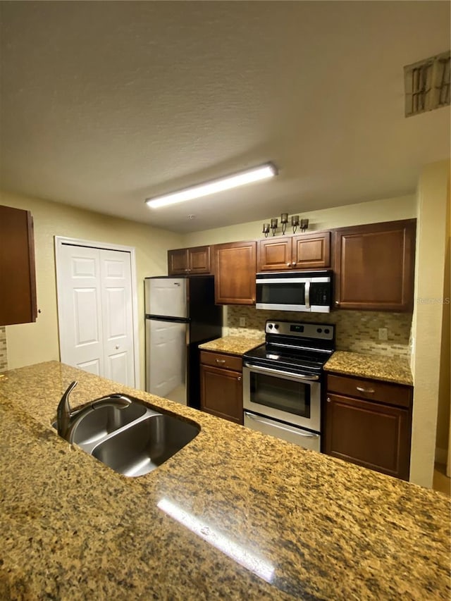 kitchen featuring stainless steel appliances and a sink