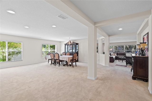 2613 Breezy Meadow Rd, Apopka, FL 32712 - dining space with light colored carpet, recessed lighting, a textured ceiling, and a chandelier