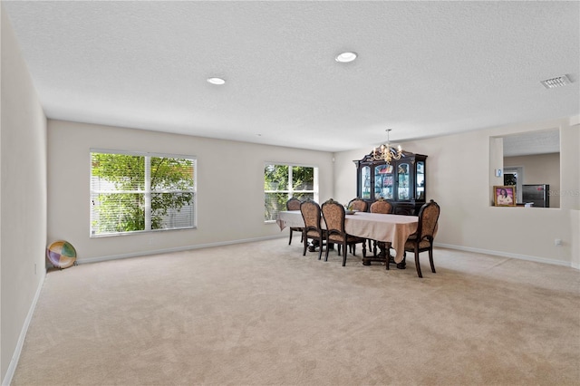 2613 Breezy Meadow Rd, Apopka, FL 32712 - carpeted dining area featuring a textured ceiling, a chandelier, and recessed lighting