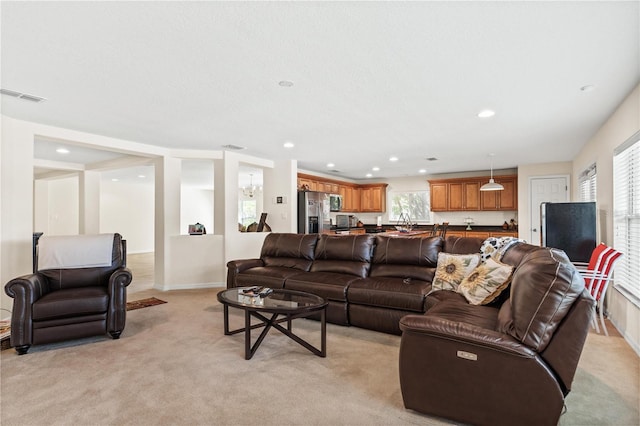 2613 Breezy Meadow Rd, Apopka, FL 32712 - living room featuring light colored carpet, plenty of natural light, and recessed lighting