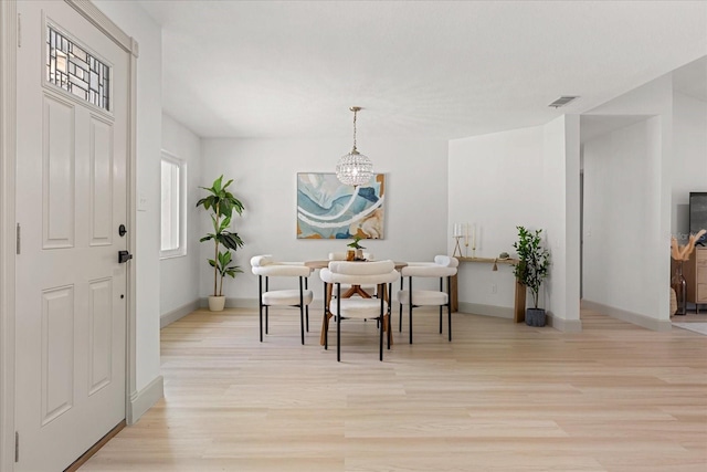 1030 Huntington Ct, Longwood, FL 32750 - dining area with a chandelier and light wood-style floors
