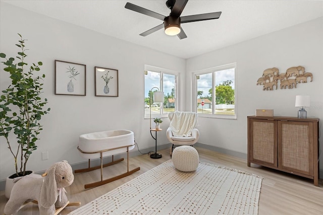 1030 Huntington Ct, Longwood, FL 32750 - living area featuring light wood-style flooring and a ceiling fan