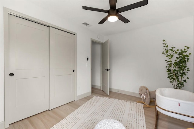 1030 Huntington Ct, Longwood, FL 32750 - bedroom featuring light wood finished floors, a closet, and a ceiling fan