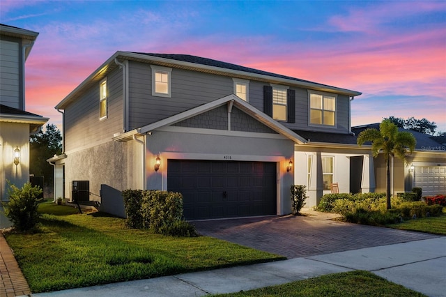 4316 Foggy Oak Ln, Sanford, FL 32773 - traditional-style home with decorative driveway, a lawn, and stucco siding