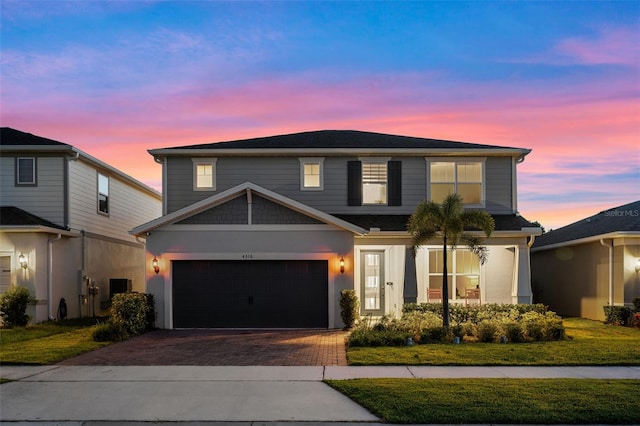 4316 Foggy Oak Ln, Sanford, FL 32773 - traditional-style house with decorative driveway, a garage, and a front lawn