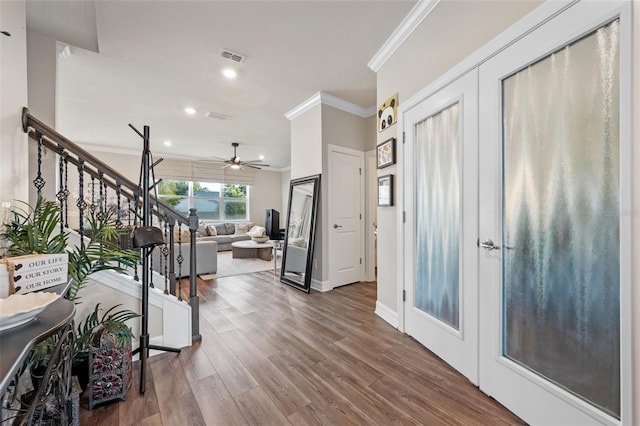 4316 Foggy Oak Ln, Sanford, FL 32773 - entryway with ornamental molding, ceiling fan, wood finished floors, stairs, and recessed lighting