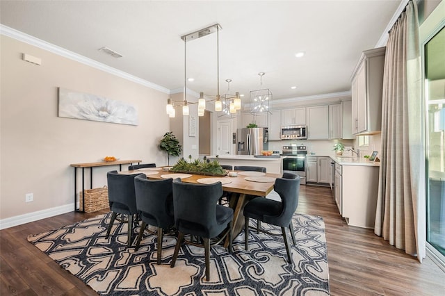 4316 Foggy Oak Ln, Sanford, FL 32773 - dining room with crown molding, dark wood-type flooring, a chandelier, and recessed lighting