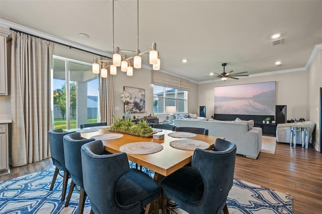 4316 Foggy Oak Ln, Sanford, FL 32773 - dining area with crown molding, wood finished floors, ceiling fan, and recessed lighting