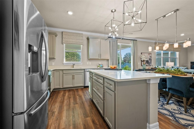 4316 Foggy Oak Ln, Sanford, FL 32773 - kitchen featuring stainless steel fridge, a chandelier, ornamental molding, light countertops, and dark wood-style floors