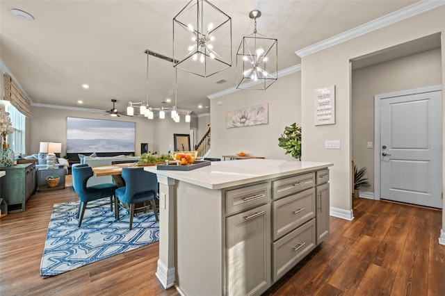 4316 Foggy Oak Ln, Sanford, FL 32773 - kitchen featuring open floor plan, gray cabinetry, crown molding, a kitchen island, and light countertops