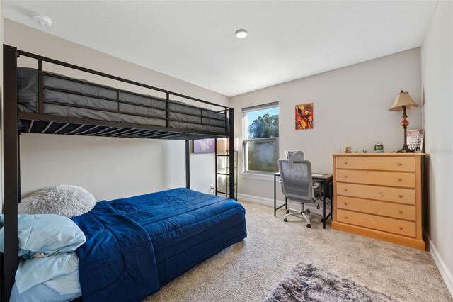 4316 Foggy Oak Ln, Sanford, FL 32773 - carpeted bedroom featuring baseboards and a desk