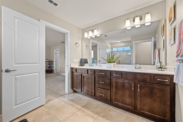 4316 Foggy Oak Ln, Sanford, FL 32773 - full bathroom with double vanity, tile patterned floors, and a shower
