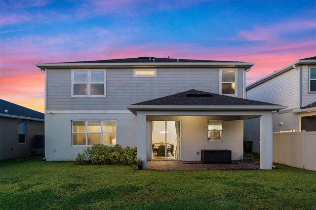 4316 Foggy Oak Ln, Sanford, FL 32773 - back of house at dusk featuring stucco siding
