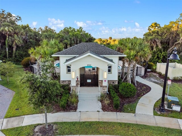 4316 Foggy Oak Ln, Sanford, FL 32773 - view of front of property with stone siding and roof with shingles
