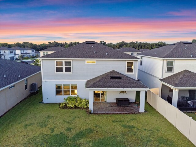 4316 Foggy Oak Ln, Sanford, FL 32773 - rear view of property with a patio area, a fenced backyard, roof with shingles, and a residential view