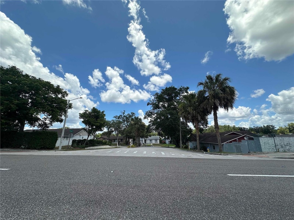 448 S Meander Dr, Altamonte Springs, FL 32714 - view of asphalt road featuring street lighting, curbs, sidewalks, and a residential view