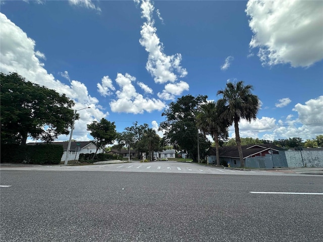 448 S Meander Dr, Altamonte Springs, FL 32714 - view of asphalt road featuring street lighting, curbs, sidewalks, and a residential view