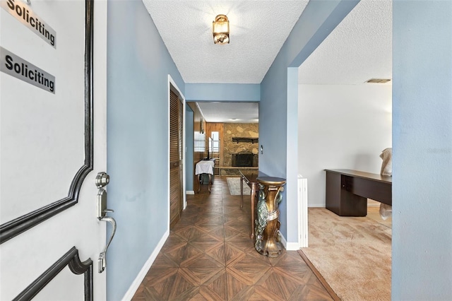 1515 Colonist Ct, Orlando, FL 32818 - foyer entrance featuring a textured ceiling and a fireplace