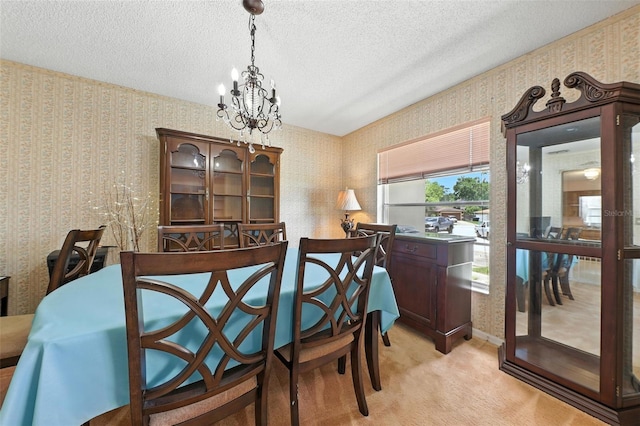 1515 Colonist Ct, Orlando, FL 32818 - dining area featuring a chandelier, wallpapered walls, light colored carpet, and a textured ceiling