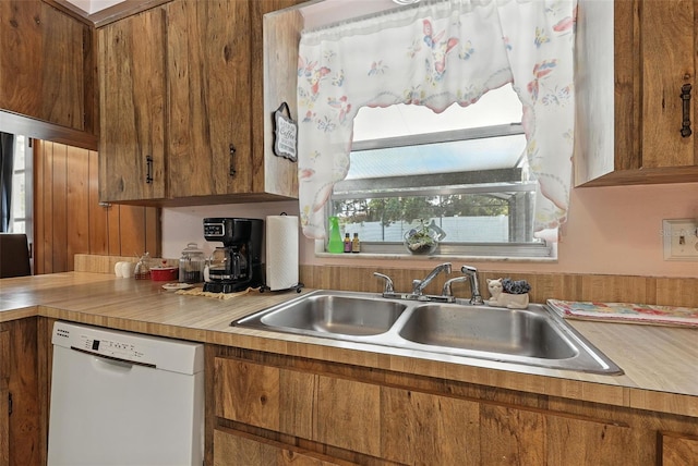 1515 Colonist Ct, Orlando, FL 32818 - kitchen with dishwasher, light countertops, and brown cabinetry