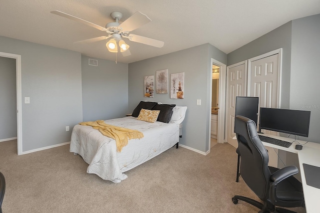 2550 Alafaya Trl Unit 9303, Orlando, FL 32826 - bedroom featuring carpet floors, an office area, a ceiling fan, and ensuite bathroom