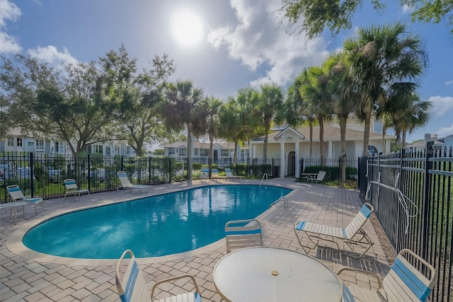 2550 Alafaya Trl Unit 9303, Orlando, FL 32826 - community pool with a patio area and a residential view