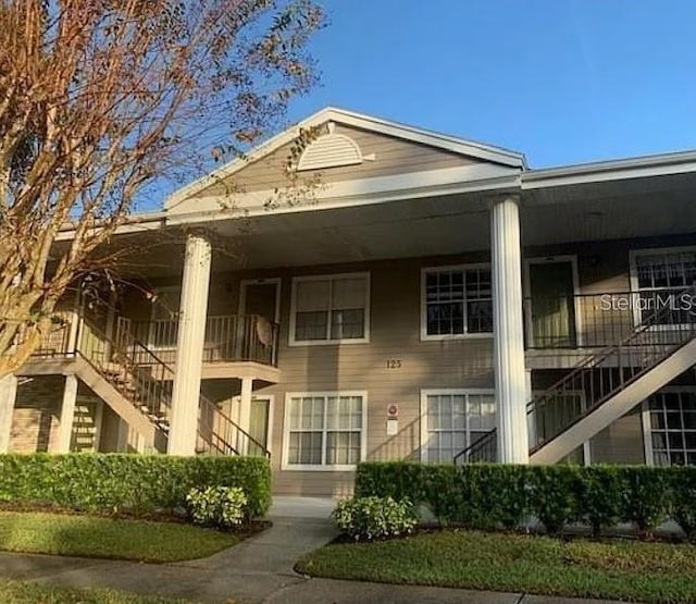 125 Reserve Cir Unit 205, Oviedo, FL 32765 - view of building exterior with stairway