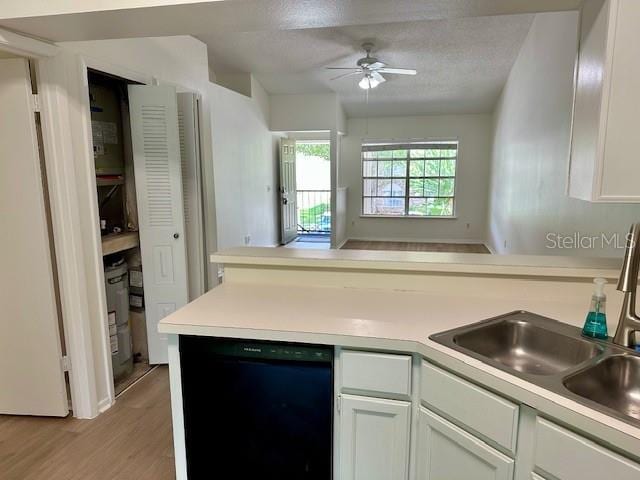 125 Reserve Cir Unit 205, Oviedo, FL 32765 - kitchen featuring black dishwasher, a peninsula, a ceiling fan, light wood finished floors, and open floor plan