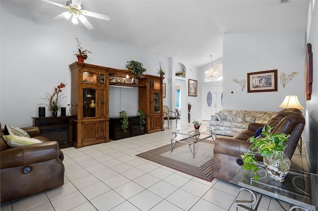 527 Durango Loop St, Davenport, FL 33897 - living room with vaulted ceiling, light tile patterned floors, a ceiling fan, and a chandelier