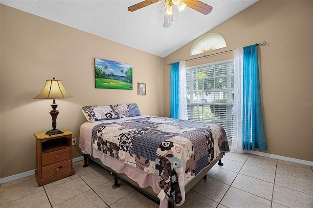 527 Durango Loop St, Davenport, FL 33897 - bedroom with tile patterned flooring, lofted ceiling, a textured ceiling, and ceiling fan