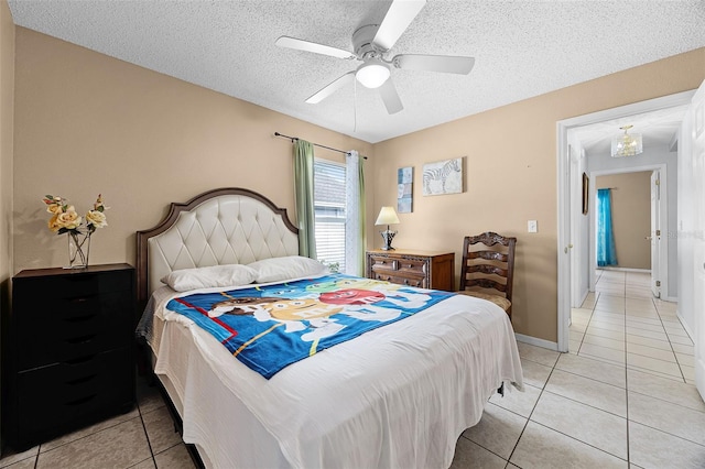 527 Durango Loop St, Davenport, FL 33897 - bedroom with light tile patterned flooring, a textured ceiling, and a ceiling fan