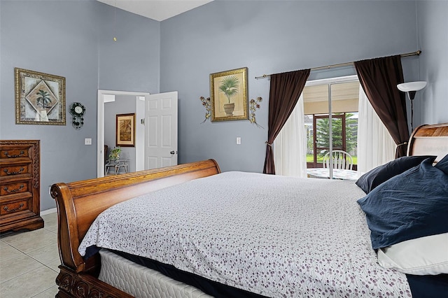 527 Durango Loop St, Davenport, FL 33897 - bedroom with access to exterior, a towering ceiling, and light tile patterned flooring