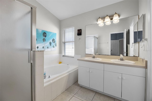 527 Durango Loop St, Davenport, FL 33897 - full bath with double vanity, a shower stall, tile patterned floors, and a bath