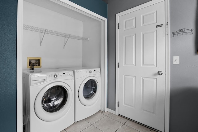 527 Durango Loop St, Davenport, FL 33897 - washroom featuring light tile patterned flooring and separate washer and dryer