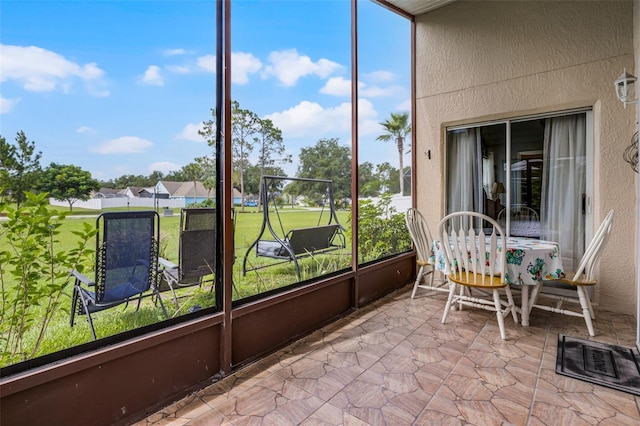 527 Durango Loop St, Davenport, FL 33897 - sunroom / solarium featuring a textured wall