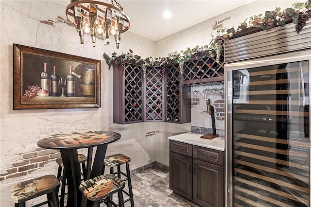 14315 80th Ave, Sebastian, FL 32958 - indoor dry bar featuring wine cooler and a chandelier