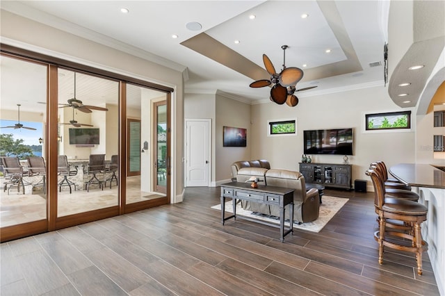 14315 80th Ave, Sebastian, FL 32958 - living room with a ceiling fan, a raised ceiling, dark wood-type flooring, crown molding, and recessed lighting