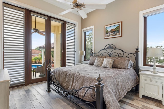 14315 80th Ave, Sebastian, FL 32958 - bedroom featuring access to outside, wood finished floors, multiple windows, french doors, and ornamental molding