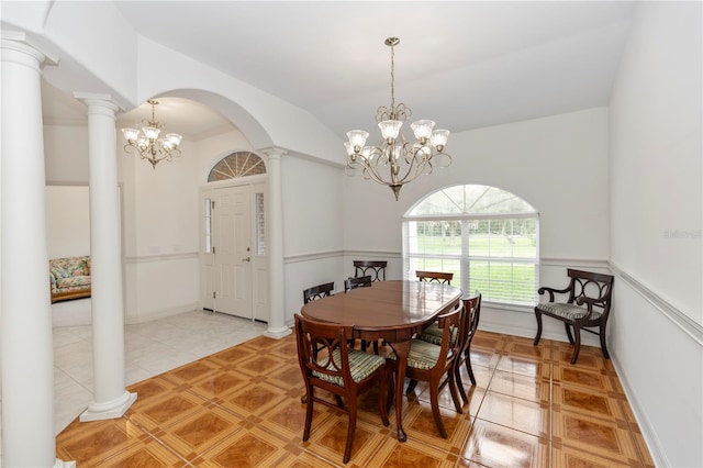 1908 S Farm Rd, Deland, FL 32720 - dining space featuring a chandelier, light tile patterned flooring, ornate columns, and arched walkways