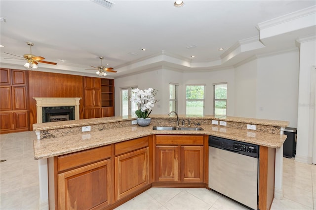 1908 S Farm Rd, Deland, FL 32720 - kitchen with stainless steel dishwasher, a tray ceiling, light stone countertops, open floor plan, and crown molding
