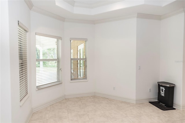 1908 S Farm Rd, Deland, FL 32720 - spare room featuring crown molding, a raised ceiling, and light tile patterned floors