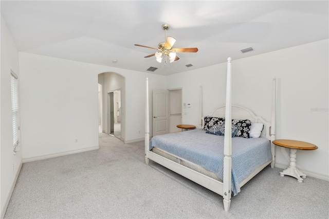 1908 S Farm Rd, Deland, FL 32720 - carpeted bedroom featuring arched walkways and a ceiling fan