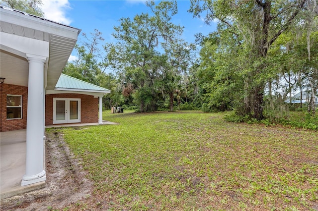 1908 S Farm Rd, Deland, FL 32720 - view of grassy yard featuring french doors