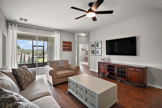 5116 Tempic Dr, Mount Dora, FL 32757 - living room with a ceiling fan, dark wood-style flooring, and a textured ceiling