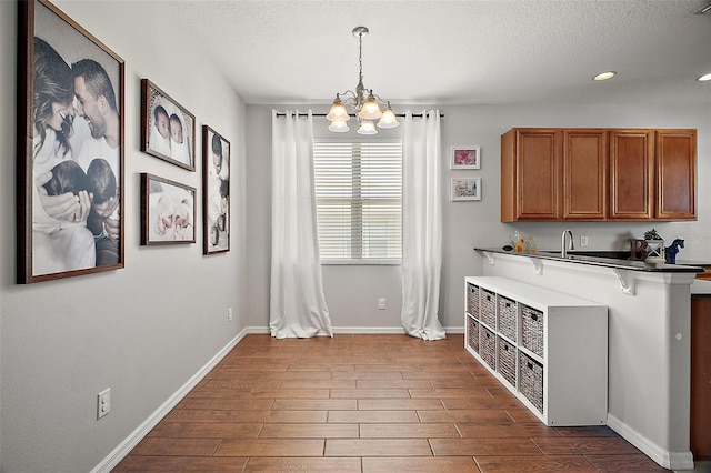 5116 Tempic Dr, Mount Dora, FL 32757 - unfurnished dining area featuring a chandelier, dark wood finished floors, a textured ceiling, and recessed lighting