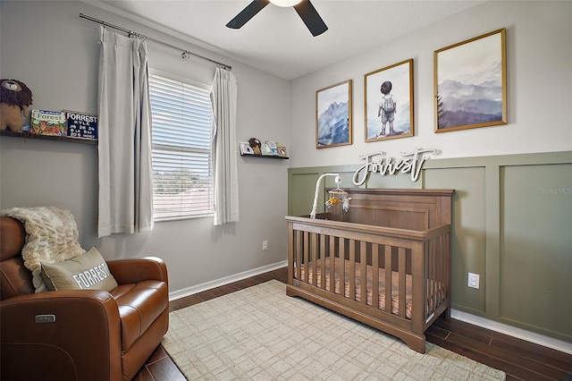5116 Tempic Dr, Mount Dora, FL 32757 - bedroom featuring a crib, wood finished floors, and ceiling fan